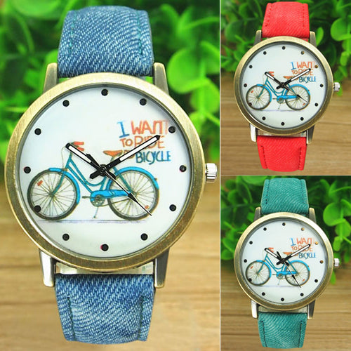 Reloj de pulsera analógico de cuarzo con correa de tela Jean de bronce para bicicleta a la moda para mujer